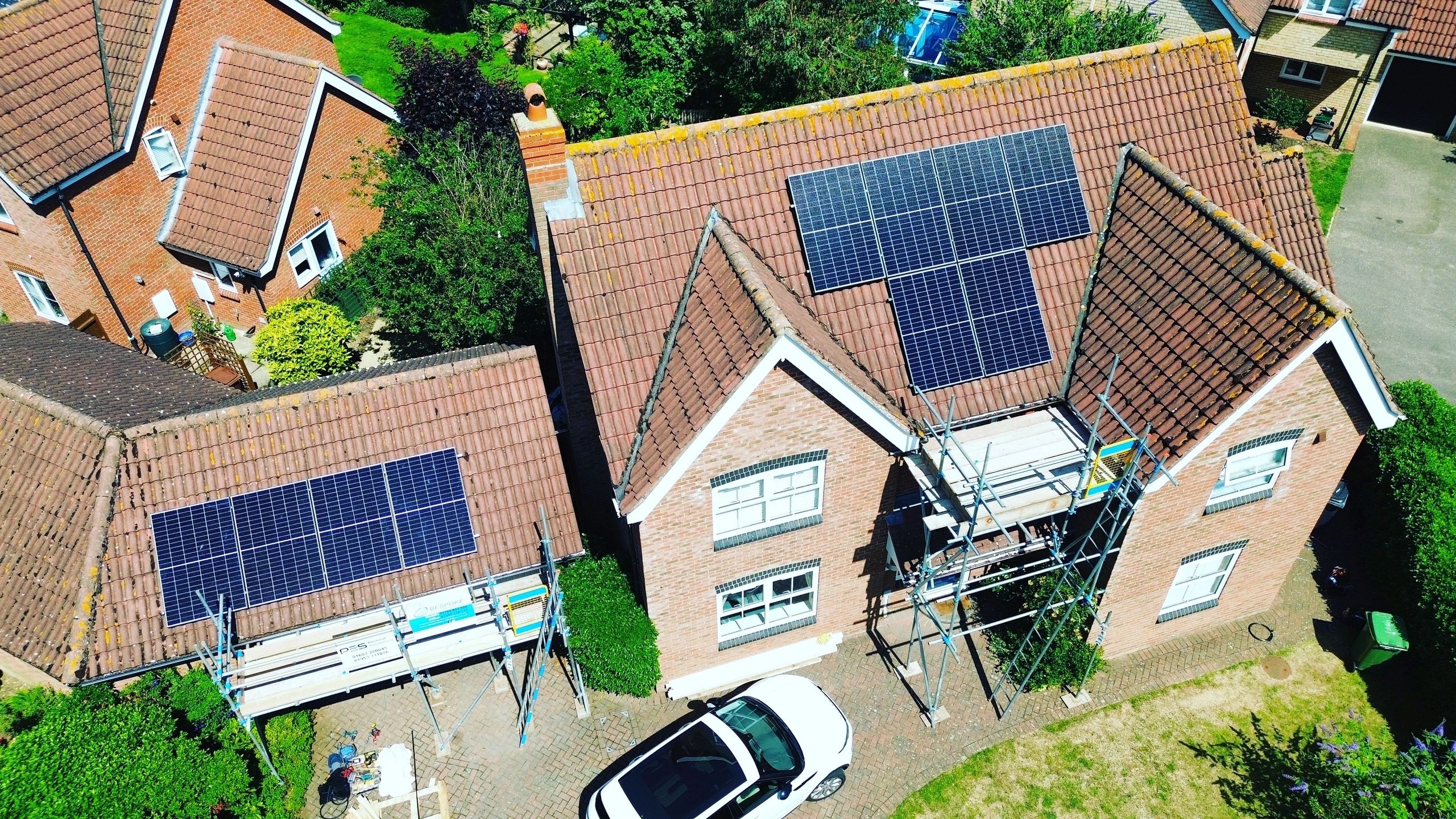 Solar panel installation team on rooftop